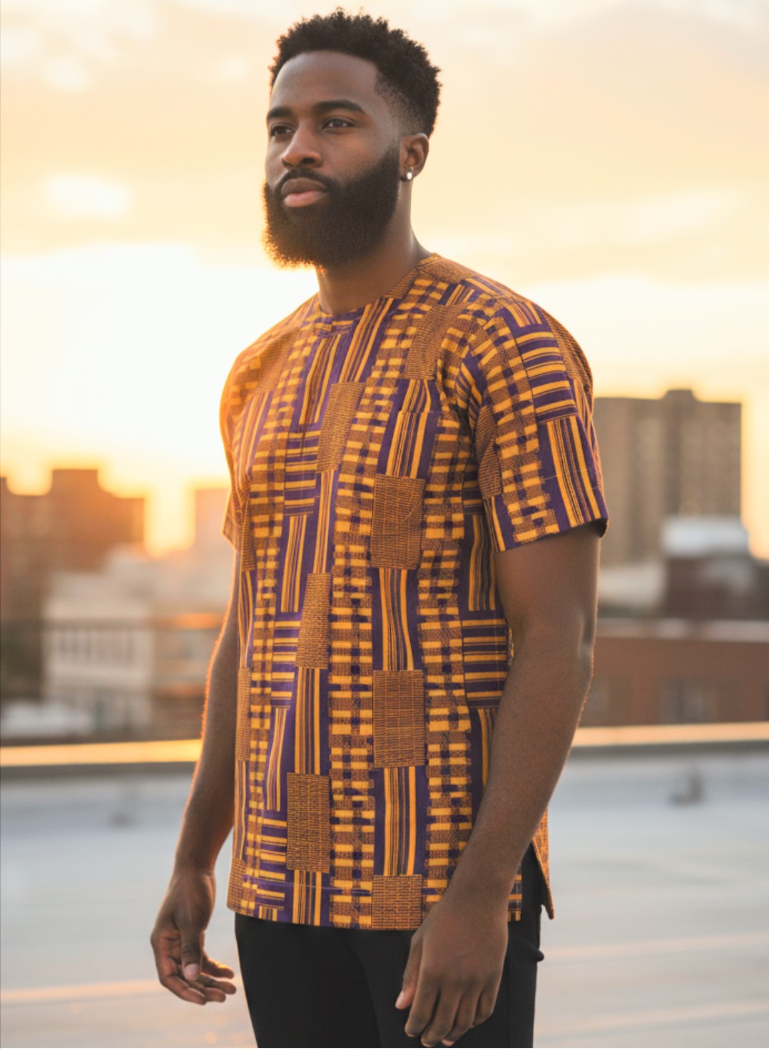 Stylish African attire featuring symbols of royalty and prosperity in a Kente Dashiki