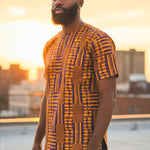 Stylish African attire featuring symbols of royalty and prosperity in a Kente Dashiki
