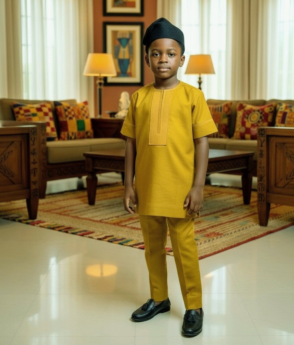 Child in yellow Dupsie's traditional Dashiki Shirt standing in a living room with decor.