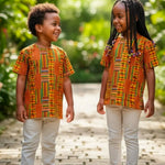 A boy and a girl wearing Dupsie's African Fashion's Kente Dashiki Shirt