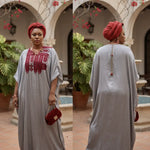 Nigerian wedding guest African dress Rafiat, a silver silk-like kaftan with red embroidery, perfect African attire for African parties and weddings.