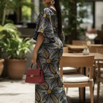 Woman wearing Aniyah Dupsie's African Print dress in outdoor setting.