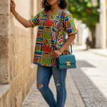Detailed view of Lema Dashiki top showcasing its Kente print and button design