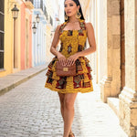 African attire for women featuring smocked bodice Ankara mini dress in vibrant African fashion print.