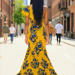 Back view of high-low African dress with dramatic train and zipper, designed in premium cotton Ankara by Dupsie’s African Fashion.