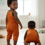 African clothing for toddlers featuring orange and green Ankara print onesie by Dupsie's African Fashion.