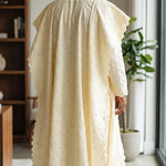 Traditional African Lace Agbada attire featuring silver embroidery