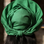 Stylish African fashion head wrap, Ilumi, in green Aso Oke fabric.