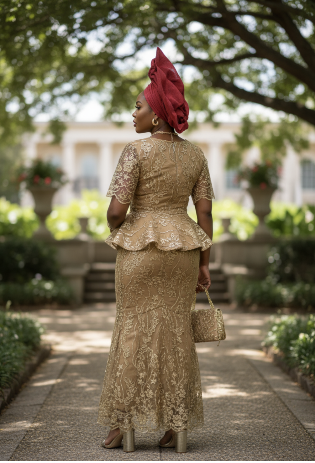Detail view of the fitted short-sleeve peplum top with a zipper and traditional hook closure on the flare skirt, highlighting African fashion elegance