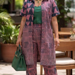 African kimono-style collared button-up long shirt and matching pants set for women.