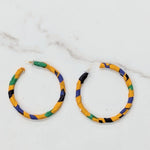 Close-up of Afryea African Print Earrings featuring vibrant Kente colors.