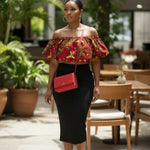 Off-the-shoulder African print crop top from Dupsie’s African Fashion styled with a black high-waisted midi skirt.