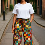 Multicolored African print patchwork wide-leg pants for women with belt loops and cotton drawstring by Dupsie’s African Fashion