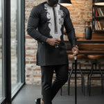 African slim-fit Senator suit for men in black with elegant silver embroidery and matching trousers.