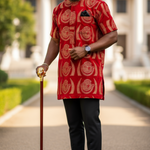 Stylish African Velvet Isiagu shirt, showcasing vibrant red and gold patterns with a pocket square and black loafers