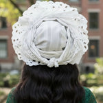 Elegant African wedding head wrap designed for women, featuring traditional Aso Oke elements.