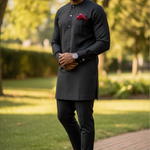All Black African Senator Dashiki Top Elegant black dashiki with unique breast pocket pattern, three-button neckline, and cufflink-ready sleeves.