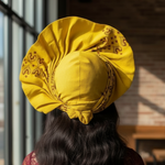 Bidemi Crown Head Wrap Hat showcasing its elegant side bow.