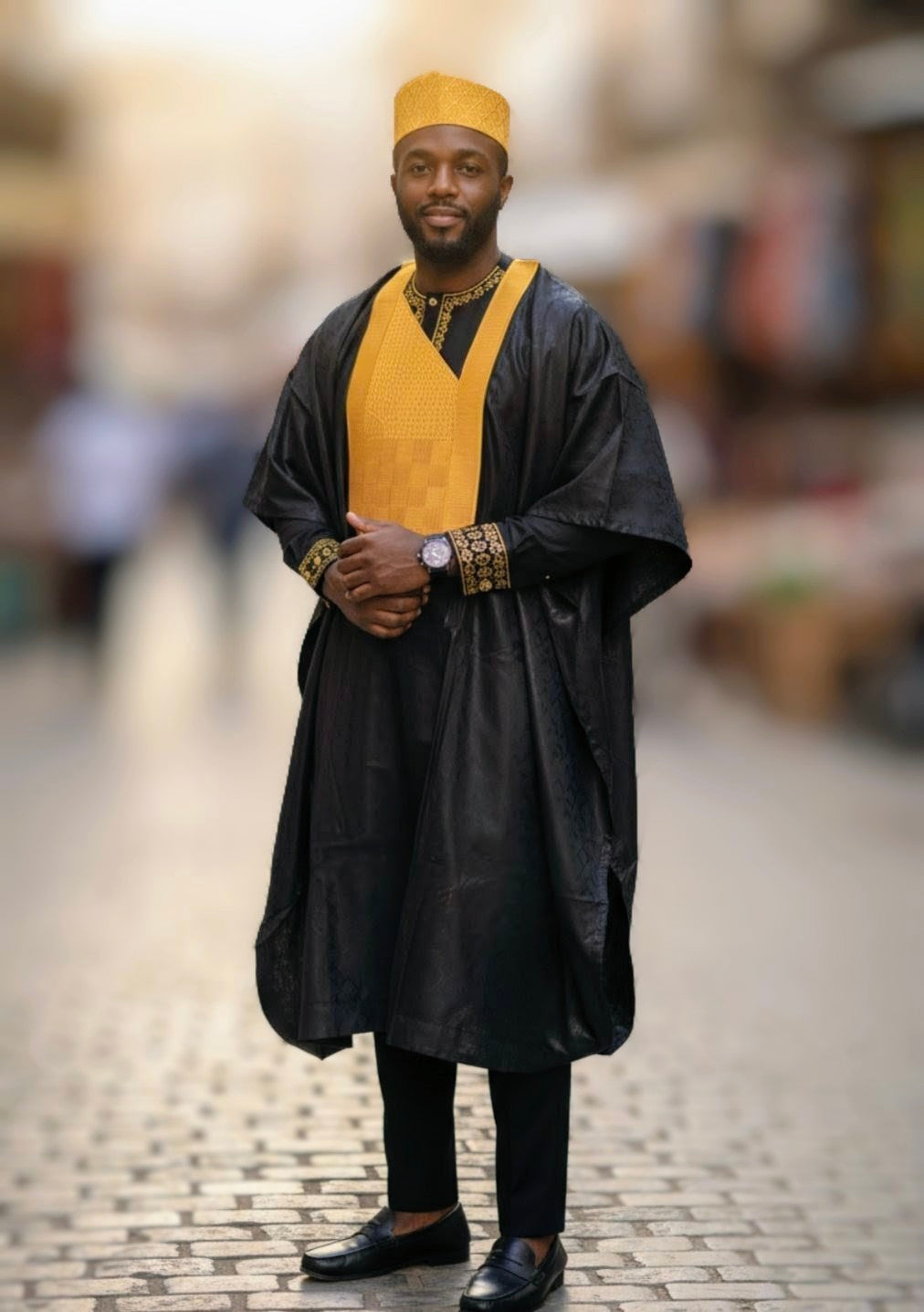 Black African Agbada Robe with Gold Embroidery from Dupsie’s African Fashion, ideal for special occasions. 