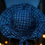 Model wearing the Bleau Aso Oke hat at a Nigerian wedding, embracing African elegance.