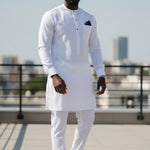 Side profile of Dupsie’s all-white Senator dashiki set showing tailored slim fit, clean lines, and breathable fabric with matching plain drawstring trousers.