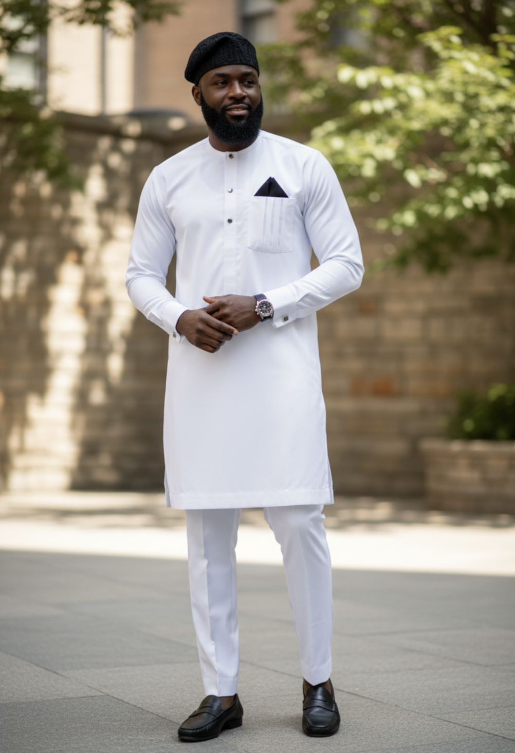 Close-up of vertical line embroidery on the breast pocket of Dupsie’s all-white Senator dashiki, crafted for refined African menswear styling.