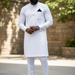 Close-up of vertical line embroidery on the breast pocket of Dupsie’s all-white Senator dashiki, crafted for refined African menswear styling.