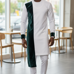 Elegant African clothing ensemble featuring a unique dashiki design with velvet accents, showcasing rich cultural symbols. 