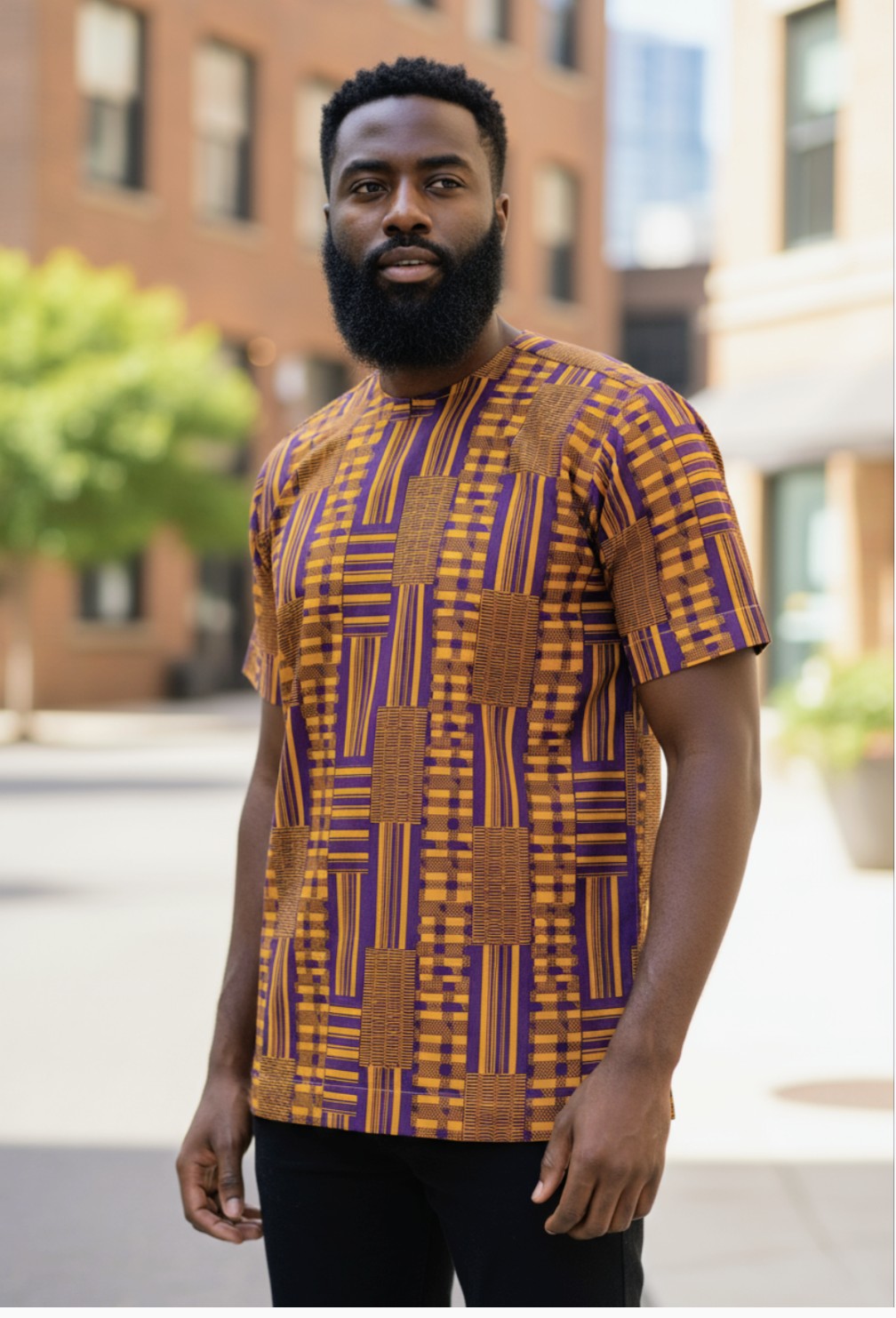 Close-up of the embroidery on a short sleeve African print Kente Dashiki.