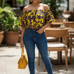 Dupsie’s African Fashion yellow and purple Ankara-inspired off-the-shoulder crop top on a model.