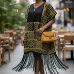 Dupsie's Rekia dress showcasing traditional African attire.