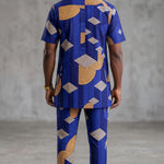 Matching Faruq African print pants for men with blue, beige and black geometric patterns.