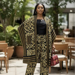 Woman wearing Ayann Kimono Top and Pants, showcasing African fashion with bold patterns.