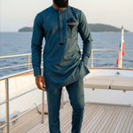 Matching green drawstring pants featuring elegant embroidery design for men 