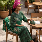 Elegant green Nigerian African party dress for women with heavy rhinestone embroidery and luxury African fashion styling.