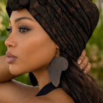 Gwel Brown Pre-Tied African Print Turban Hat on model showcasing elegance and cultural significance. 