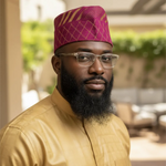 Handwoven Damask Aso Oke African hat for men in fuchsia with gold patterns, premium African clothing and African fashion accessory