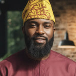 Close‑up of Nigerian Aso Oke Yoruba fila African hat for men in Yellowish‑Gold and Burgundy patterns for African clothing and African attire.