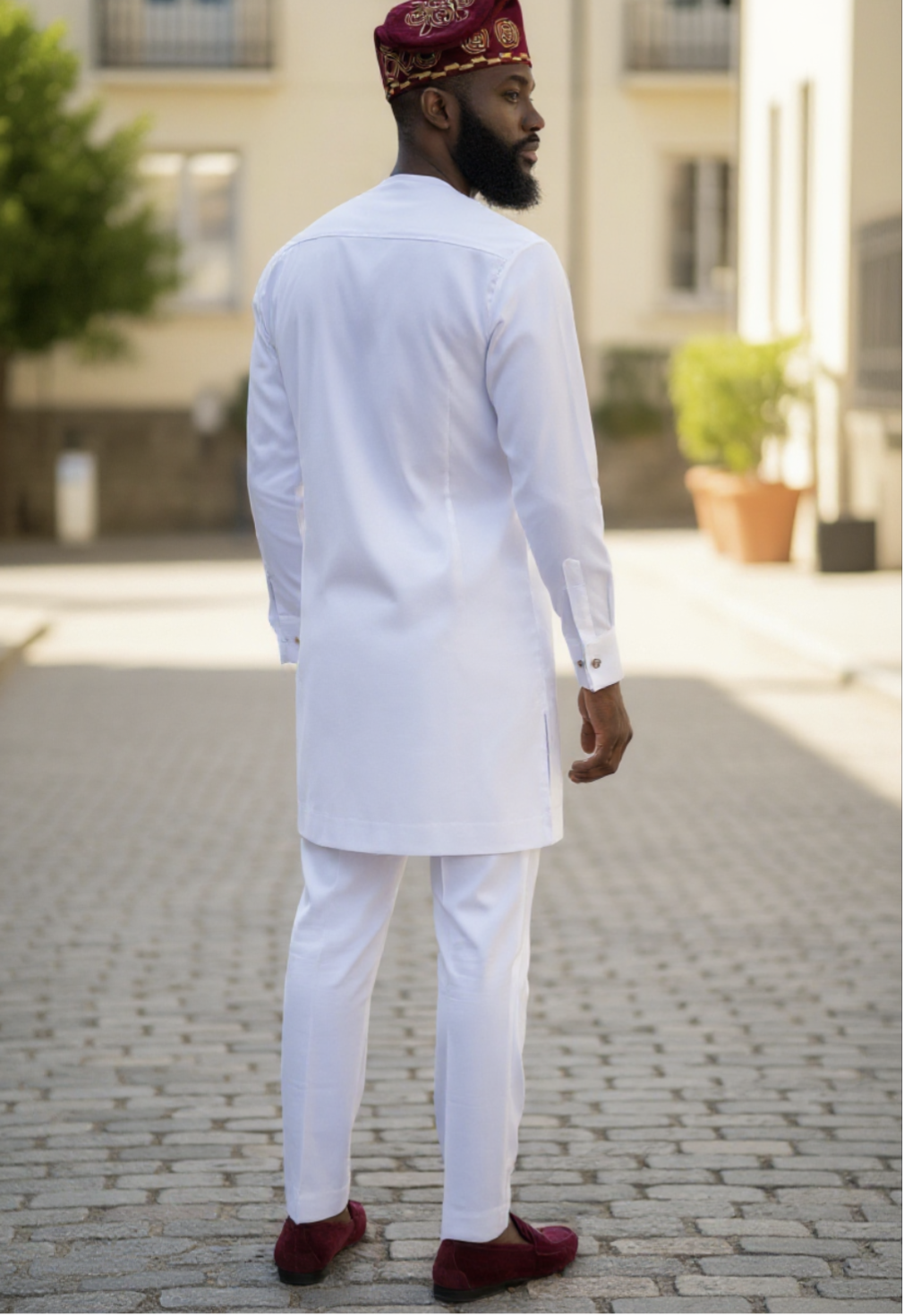 Back view of the ivory African Senator set with smooth drape and structured hem for a polished finish.