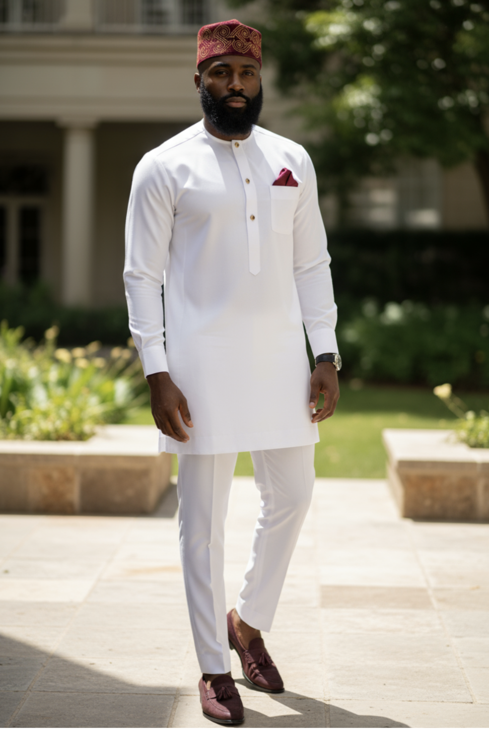 Slim‑fit ivory African Senator top with round neck and three-button placket extending to mid‑chest for a clean, modern silhouette.