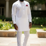 Slim‑fit ivory African Senator top with round neck and three-button placket extending to mid‑chest for a clean, modern silhouette.