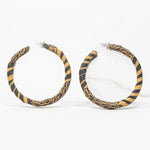 Beautiful black and gold Kente print earrings showcasing African art.