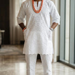 Traditional African Bini Lace Agbada 3-piece set for men with elegant silver embroidery and flowing royal African robe.