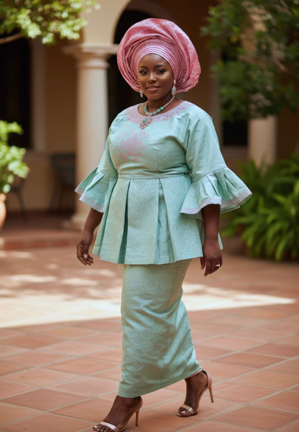 Mint‑green African brocade peplum top and ankle‑length drawstring skirt with pink embroidery by Dupsie’s African Fashion; pink pre‑tied gele shown
