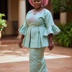 Mint‑green African brocade peplum top and ankle‑length drawstring skirt with pink embroidery by Dupsie’s African Fashion; pink pre‑tied gele shown