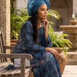 Elegant Nigerian African party dress for women with blue and purple embroidery and sparkling rhinestones.