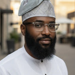 Side view of Usman gray Nigerian Aso Oke fila hat styled on a mannequin, showcasing African men fashion and traditional African clothing for weddings 