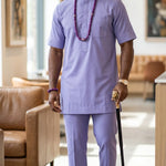 Nigerian groom fashion light purple embroidered Agbada for weddings, engagements, and formal African events.