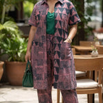 Pink and green Nigerian party fashion African pants suit for women featuring rhinestone embellishments.