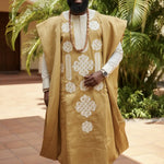 Close-up of embroidery details on Oladele Gold and Cream Aso Oke Robe.